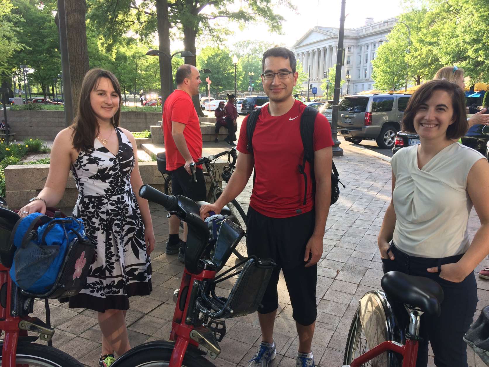 From left, Meghan McAvoy, Karl Schackmann and Ana Karimi join a community ride organized by the Washington Area Bicyclist Association on Wednesday, April 26, 2017. The ride started at Pershing Park in D.C. and took riders to some bridges that connect D.C. and Virginia. (WTOP/Abigail Constantino)