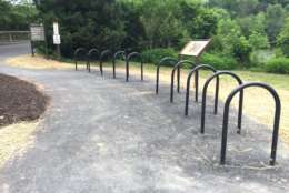 Bike racks have been installed along the Mount Vernon Trail at the entrance to Theodore Roosevelt Island to encourage cyclists to stop for a visit. Bicycles are not allowed on the island. (WTOP/Michelle Basch)