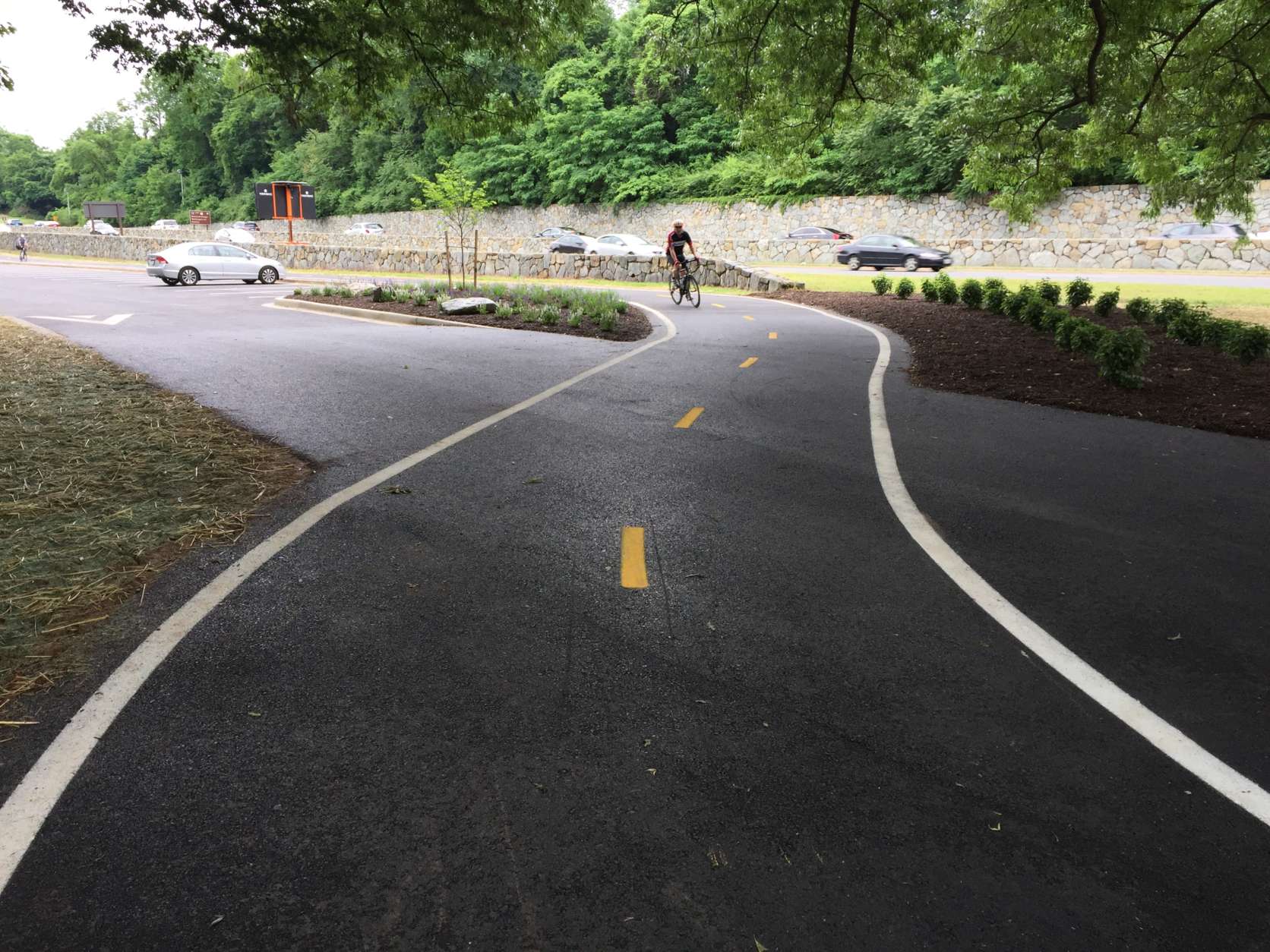 To improve safety, the Mount Vernon Trail has been realigned and raised where it crosses the parking lot at Theodore Roosevelt Island. (WTOP/Michelle Basch)