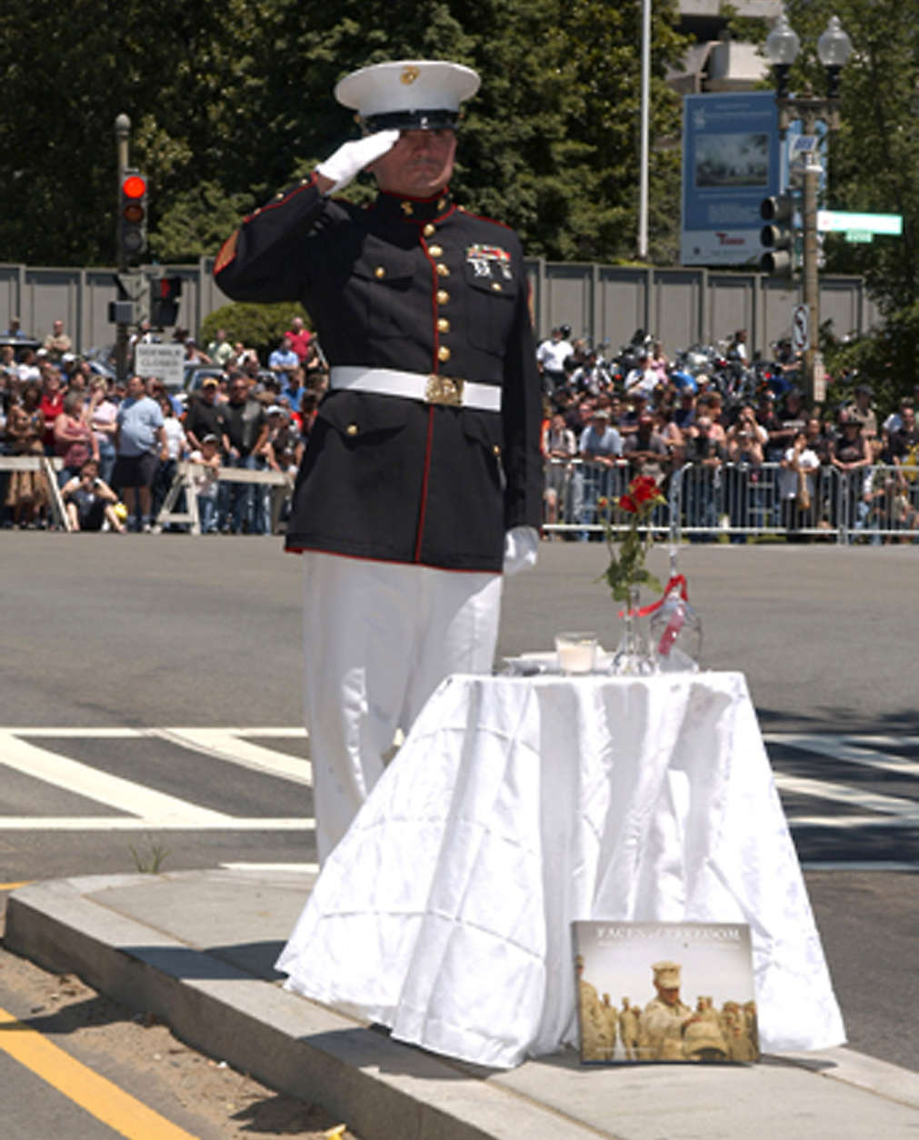 A saluting member of theMarine Corps honors a fallen comrade at the 25th annual demonstration Rolling Thunder demonstration in D.C. The group remains resolved to help bring home prisoners of war and those missing in action. (Courtesy Rolling Thunder)