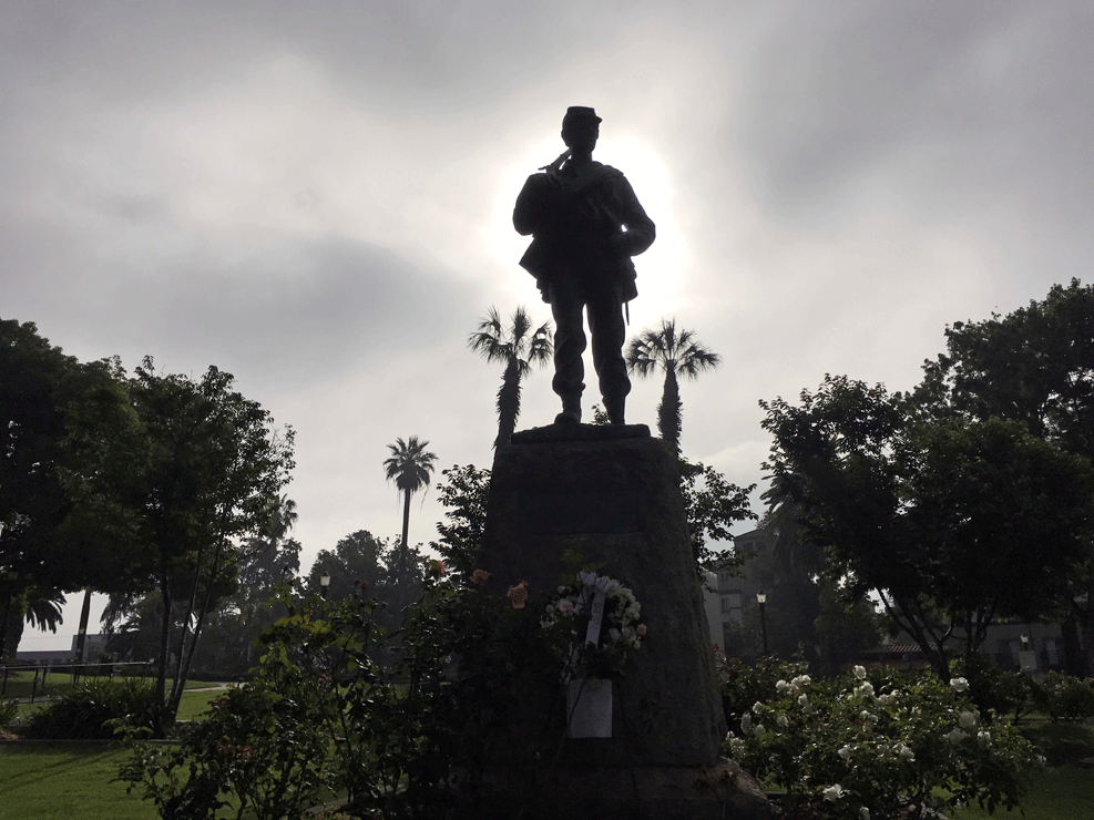 A Civil War statue dedicated to "the defenders of the Union" is silhouetted by the Memorial Day sunrise in Pasadena, Calif., on Monday, May 29, 2017. (AP Photo/John Antczak)
