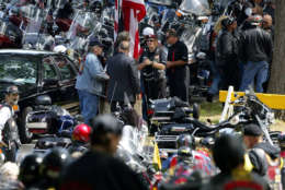 Hundreds of motorcycles arrive at Arlington National Cemetery as part of a "Rolling Thunder" ceremony for Vietnam Veterans on Saturday, May 29, 2004 in Arlington, Va.  The groups leaders will meet with President Bush on Sunday.  (AP Photo/Evan Vucci)