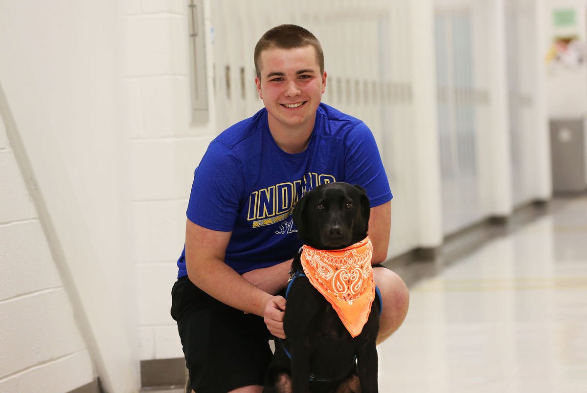 Andrew Schalk has Type 1 diabetes and uses his dog, Alpha, to alert him when his blood sugar levels are off. (Courtesy Peter Cihelka/The Free Lance-Star) 