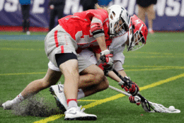 Ohio State's Tyler Pfister, left, and Maryland's Nick Manis compete for the ball during the second half of the NCAA college Division 1 lacrosse championship final, Monday, May 29, 2017, in Foxborough, Mass. (AP Photo/Elise Amendola)
