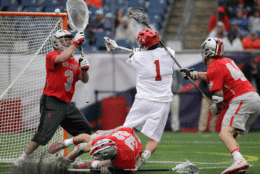 Maryland's Matt Rambo (1) scores past Ohio State goalkeeper Tom Carey (3) as Matt Borges (32) and Ben Randall (40) defend during the second half of the NCAA college Division 1 lacrosse championship final, Monday, May 29, 2017, in Foxborough, Mass. (AP Photo/Elise Amendola)