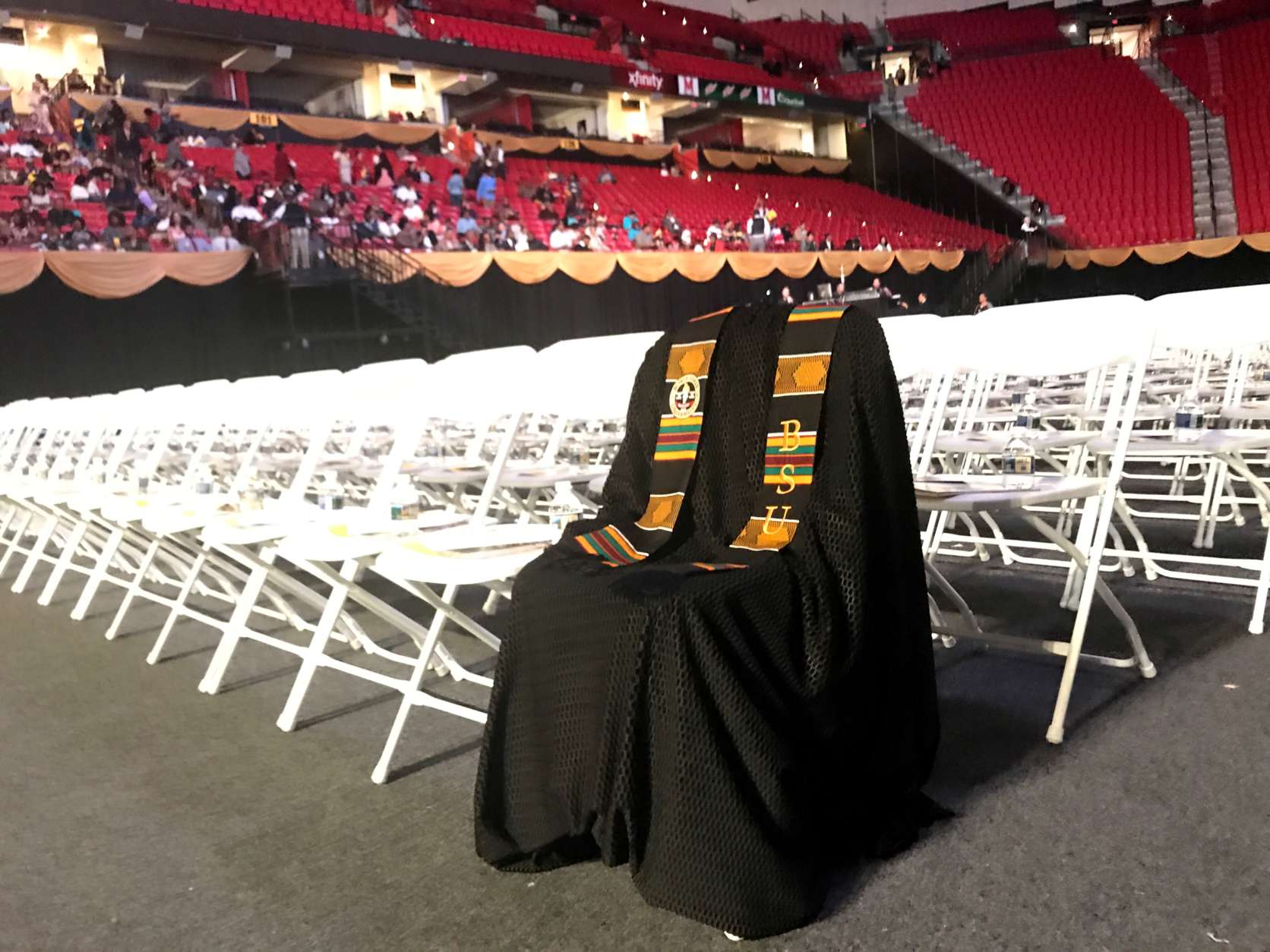 The image of murdered Lt. Richard Collins III's gown at the Bowie State University graduation has prompted a wide variety of emotions. (WTOP/Neal Augenstein)