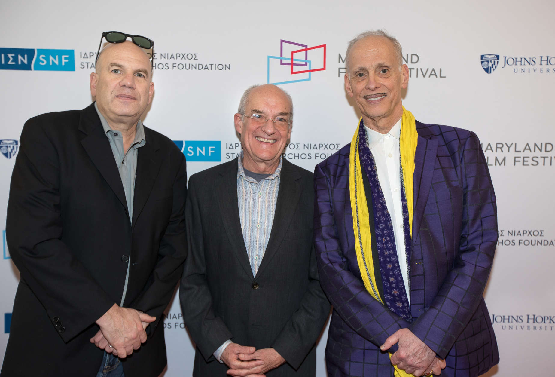Maryland Film Festival director Jed Dietz (center) appears with filmmakers David Simon (left) and John Waters (right) at the April 20 unveiling of the restored Parkway Theatre in Baltimore. (Chelsea Clough, Abel Communications)
