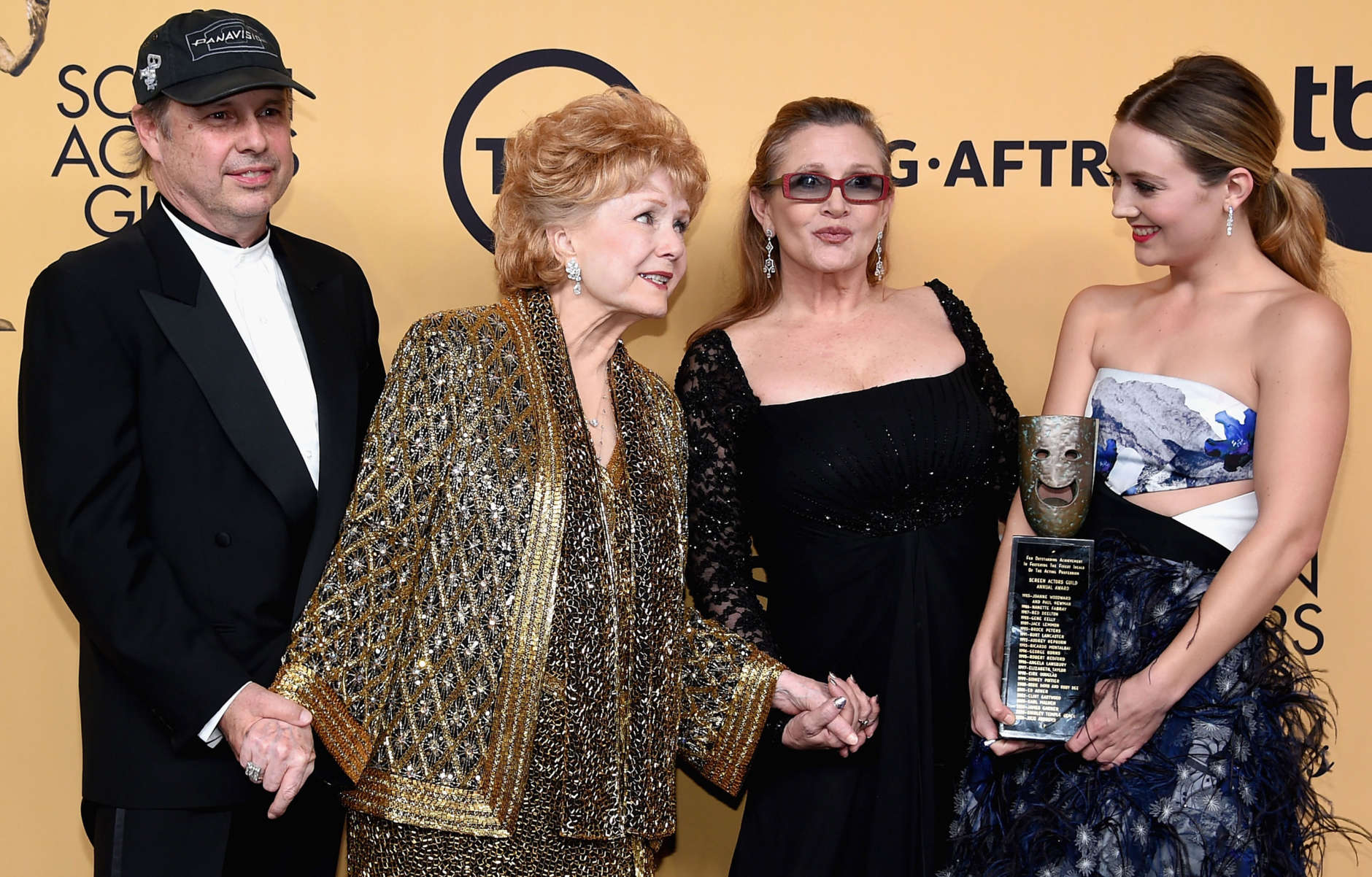 Todd Fisher, actress Debbie Reynolds, recipient of the Screen Actors Guild Life Achievement Award, actresses Carrie Fisher and Billie Lourd pose in the press room at the 21st Annual Screen Actors Guild Awards at The Shrine Auditorium on January 25, 2015 in Los Angeles, California. (Photo by Ethan Miller/Getty Images)