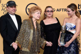 Todd Fisher, actress Debbie Reynolds, recipient of the Screen Actors Guild Life Achievement Award, actresses Carrie Fisher and Billie Lourd pose in the press room at the 21st Annual Screen Actors Guild Awards at The Shrine Auditorium on January 25, 2015 in Los Angeles, California. (Photo by Ethan Miller/Getty Images)