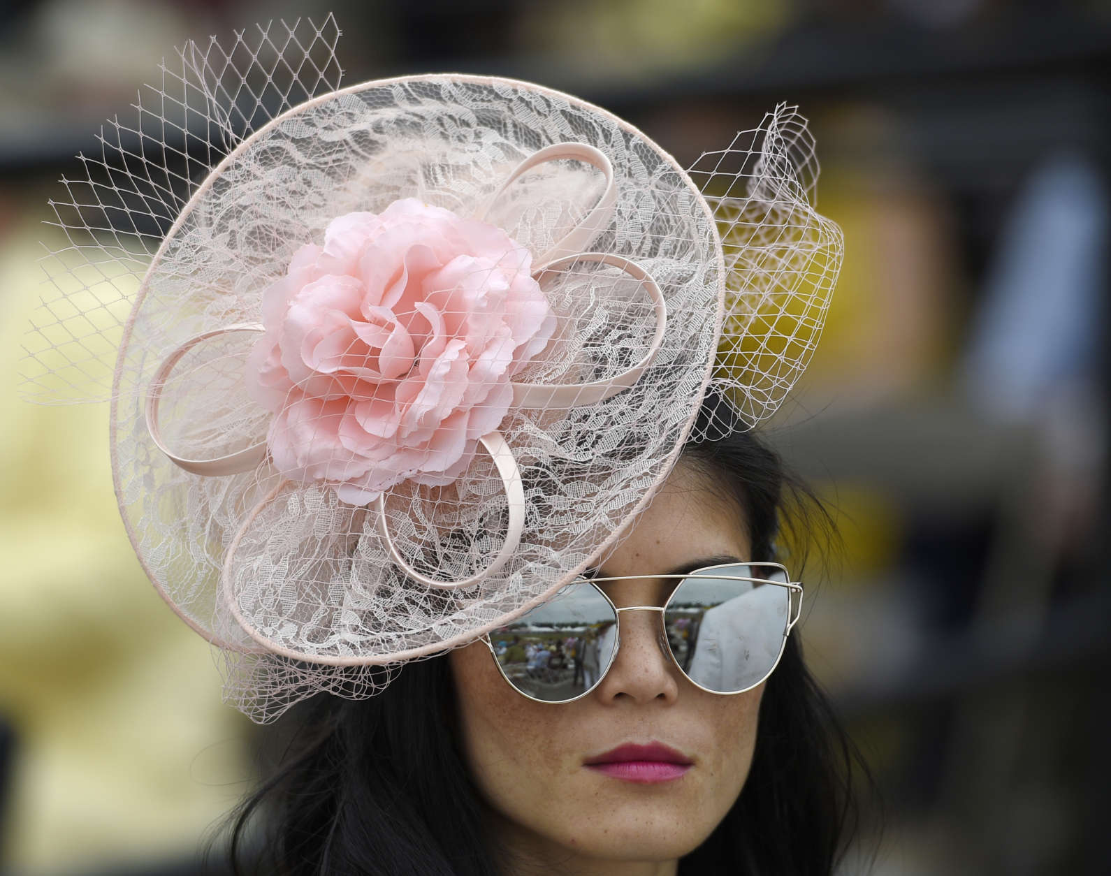 A woman walks through the grandstand ahead of the running of the 142nd Preakness Stakes horse race at Pimlico race course, Saturday, May 20, 2017, in Baltimore. (AP Photo/Nick Wass)