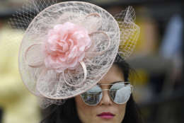 A woman walks through the grandstand ahead of the running of the 142nd Preakness Stakes horse race at Pimlico race course, Saturday, May 20, 2017, in Baltimore. (AP Photo/Nick Wass)