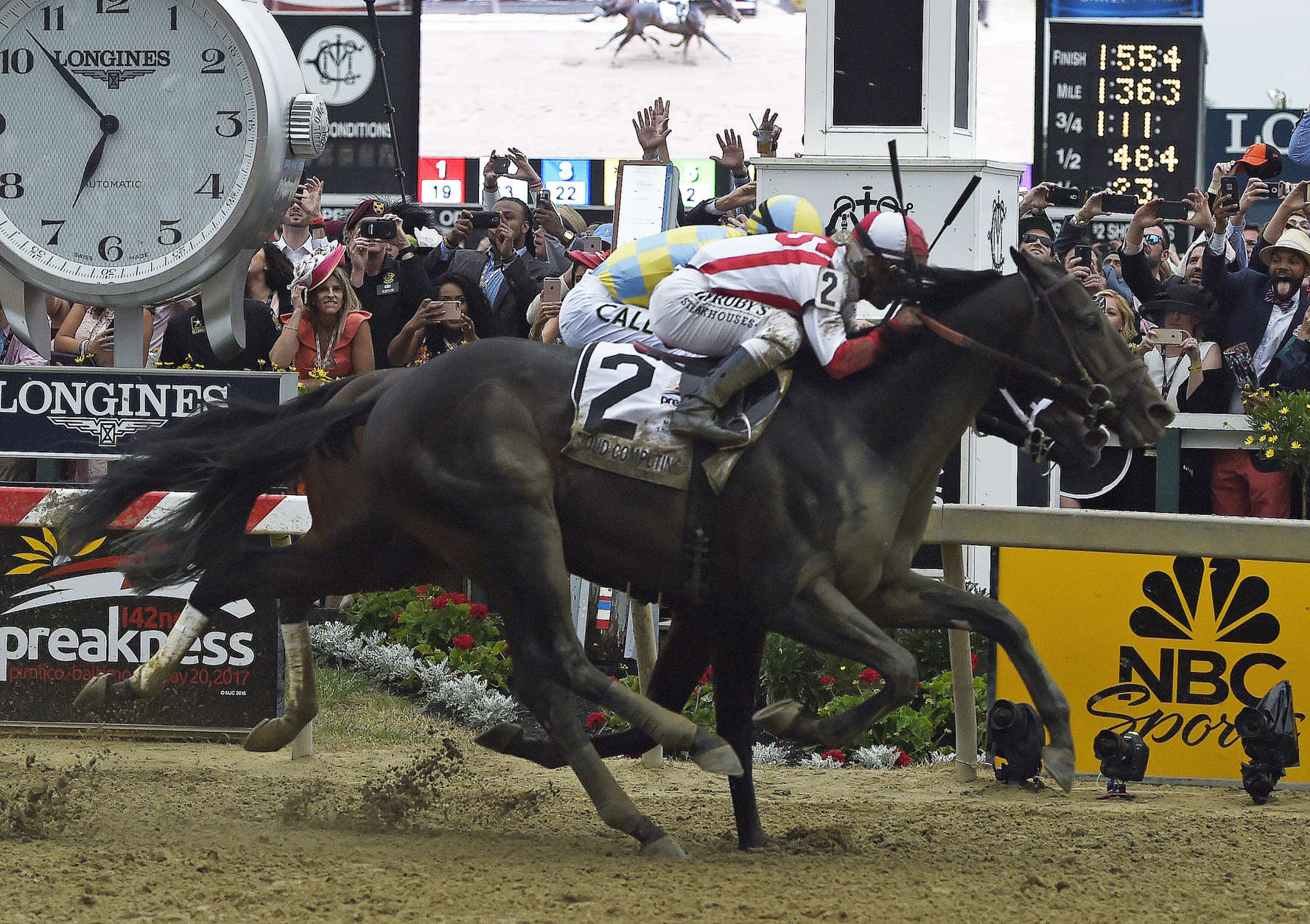 Cloud Computing (2), ridden by Javier Castellano, wins the 142nd Preakness Stakes horse race ahead of Classic Empire, ridden by Julien Leparoux, Saturday, May 20, 2017, at Pimlico Race Course in Baltimore. (AP Photo/Mike Stewart)
