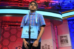 Saketh Sundar, 11, from Elkridge, Md., spells his word during the finals of the 90th Scripps National Spelling Bee, in Oxon Hill, Md., Thursday, June 1, 2017. Sundar was eliminated after misspelling his word. (AP Photo/Manuel Balce Ceneta)