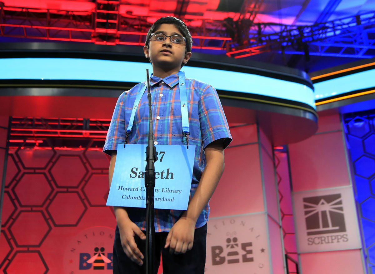 Saketh Sundar, 11, from Elkridge, Md., spells his word during the finals of the 90th Scripps National Spelling Bee, in Oxon Hill, Md., Thursday, June 1, 2017. Sundar was eliminated after misspelling his word. (AP Photo/Manuel Balce Ceneta)