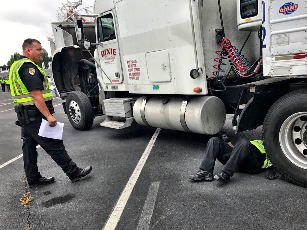 All commercial vehicles on the Beltway have to exit at FedEx Field in Landover, Maryland, for an inspection by Maryland State Police. (WTOP/Neal Augenstein)