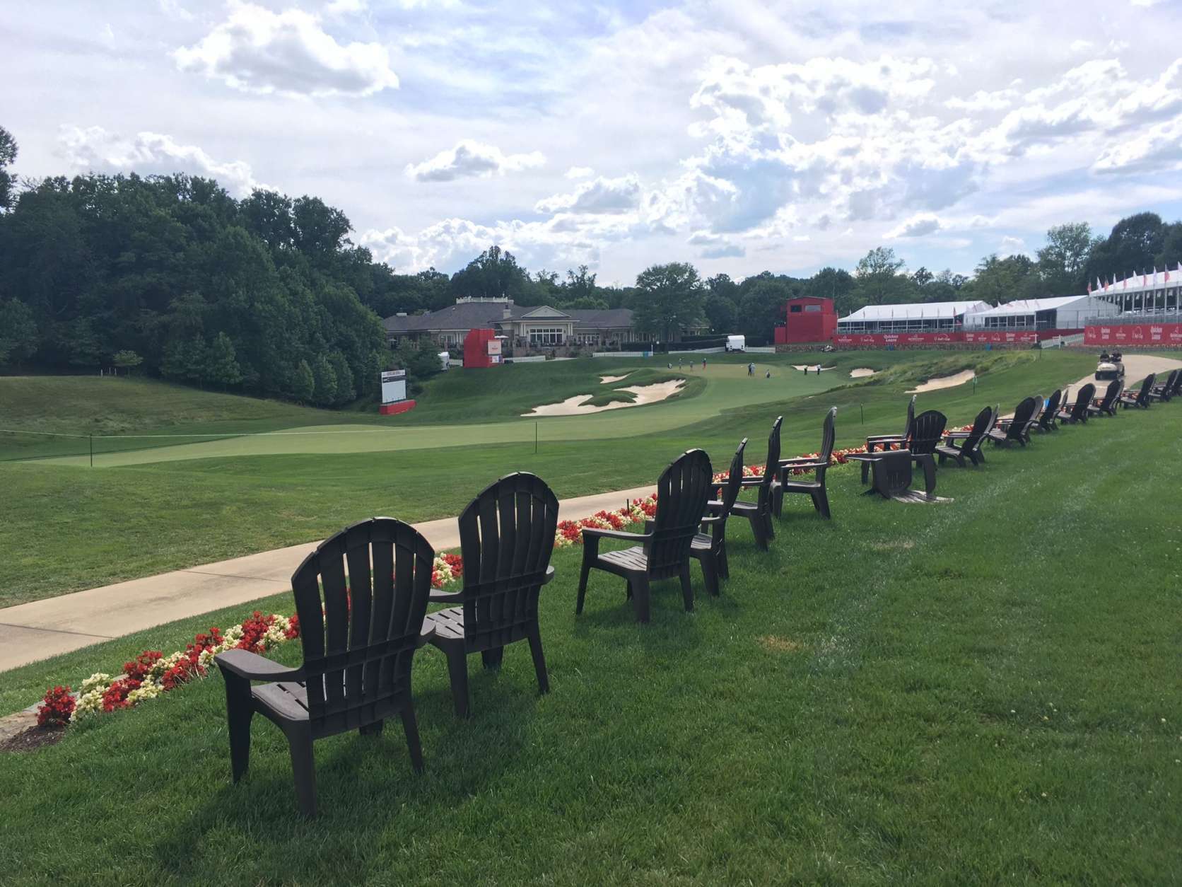 There's a decent amount of room and a couple lines of wooden chairs for spectators along the approach to 18, offering plenty of options other than just the bleachers above the green. (WTOP/Noah Frank)
