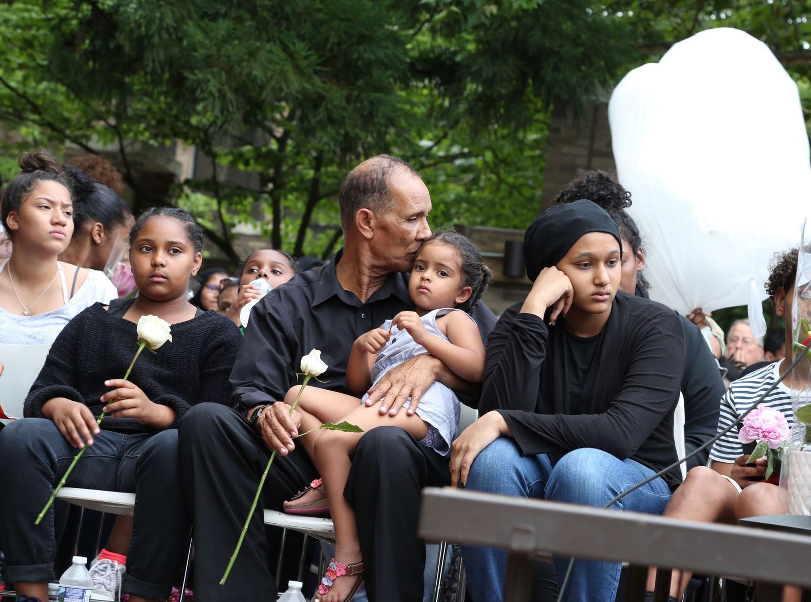 Nabra Hassanen's family looks on at a vigil in honor of Nabra on Wednesday, June 21, 2017, in Reston, Va. (WTOP/Omama Altaleb)