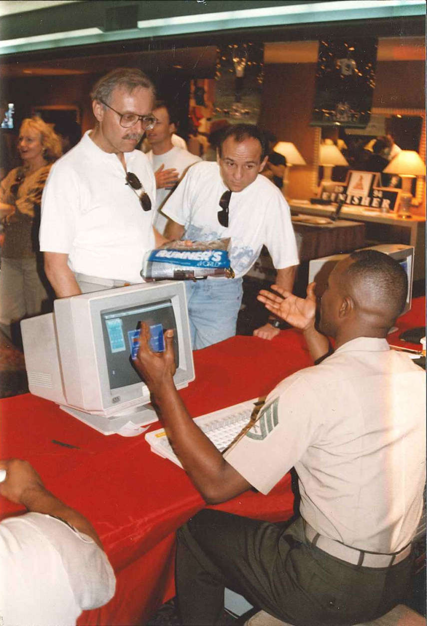 A Marine at a computer during the 1993 Marine Corps Marathon expo. (Courtesy Marine Corps Marathon)