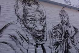 Comedians Dick Gregory (left) and Dave Chappelle are also among the new faces in the Ben's Chili Bowl mural. (WTOP/Kate Ryan)