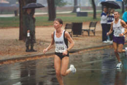 Donna Moore runs in the rain in 1997. The Kensington, Maryland, woman went on to win the race that year. (Courtesy Marine Corps Marathon)