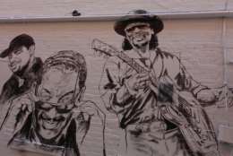 From left: Russ Parr, Donnie Simpson and Chuck Brown are among the new faces on the Ben's Chili Bowl mural (WTOP/Kate Ryan)