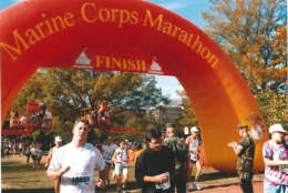 Runners cross the finish line during the 1998 race. (Courtesy Marine Corps Marathon)