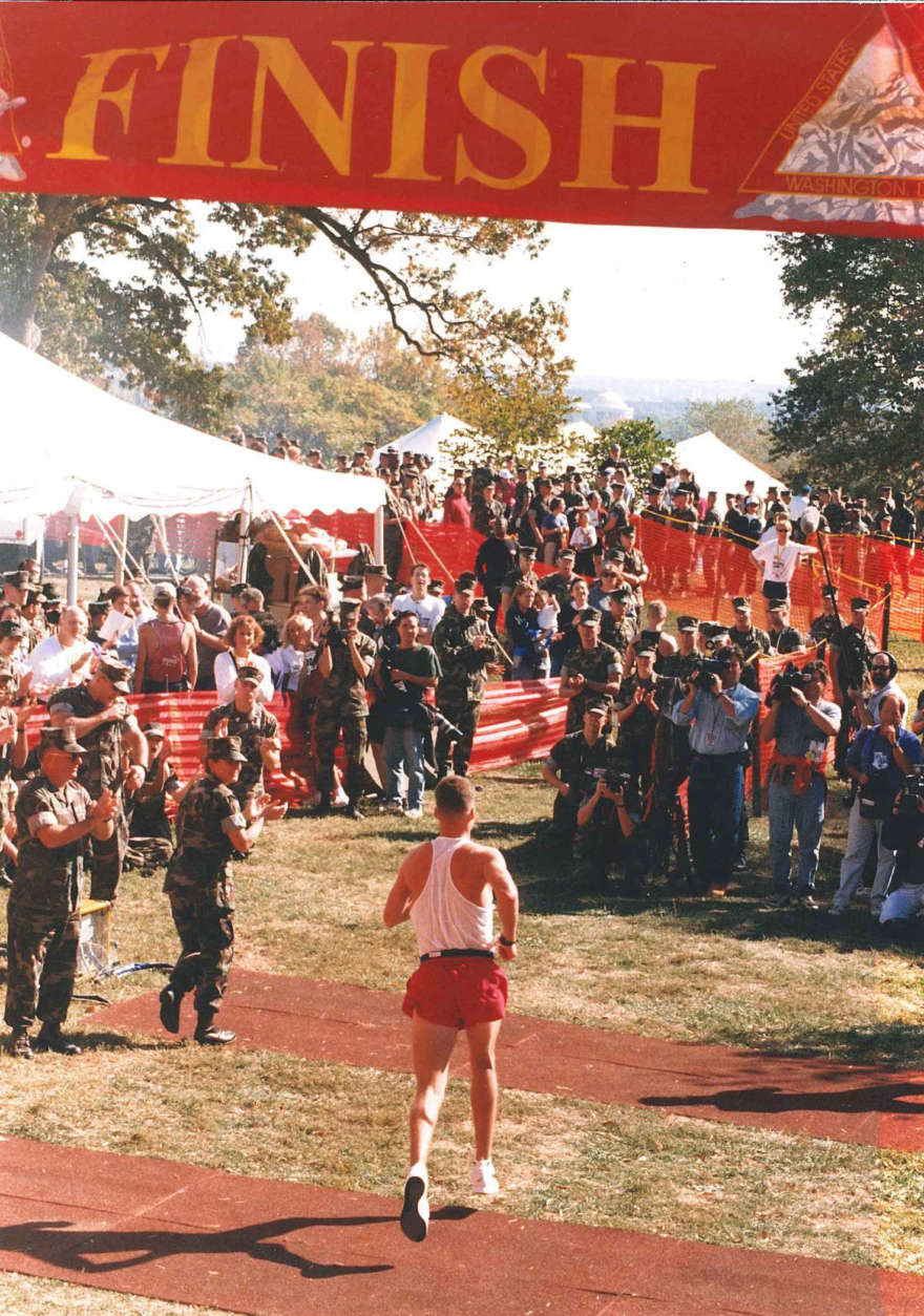 A runner crosses the finish line. Year not known. (Courtesy Marine Corps Marathon)