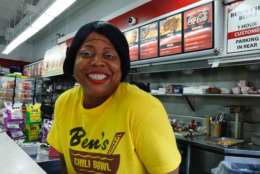Angela Powell delivers service with a smile at Ben's Chili Bowl on U Street. (WTOP/Kate Ryan)