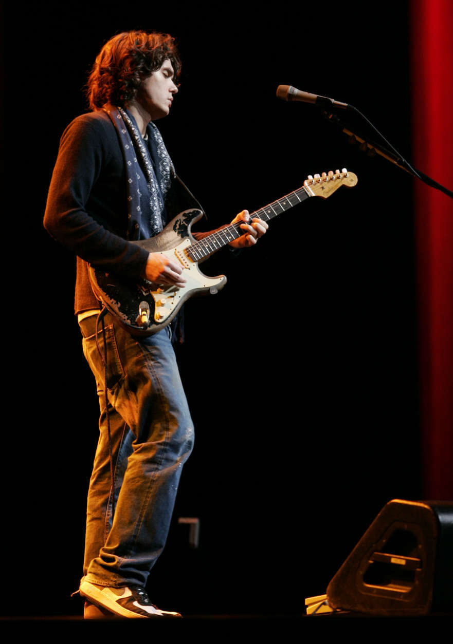 Musician John Mayer performs during Apple's unveiling of the new iPhone during Apple CEO Steve Jobs' keynote address at MacWorld Conference &amp; Expo in San Francisco, Tuesday, Jan. 9, 2007. (AP Photo/Paul Sakuma)