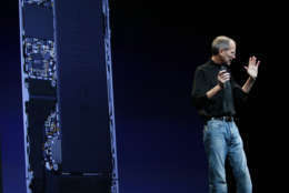 In this June 7, 2010 photo, Apple CEO Steve Jobs talks about the composition and metal antennae band that surrounds the new Apple iPhone4 at the Apple Worldwide Developers Conference, in San Francisco. Apple Inc. said Friday that it was "stunned" to find that its iPhones have for years been using a "totally wrong" formula to determine how many bars of signal strength they are getting. (AP Photo/Paul Sakuma)