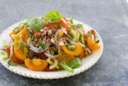 This Aug. 1, 2011 photo shows heirloom and cherry tomato salad in Concord, N.H.  For the APs 20 Salads of Summer series, Alice Waters offered this recipe for a simple but stunning salad.  (AP Photo/Matthew Mead)