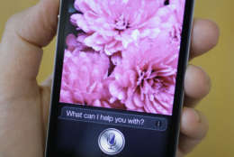 In this photo taken Monday Oct. 10, 2011, Siri, the new virtual assistant, is displayed on the new Apple iPhone 4S in San Francisco. The 4S will be available Friday in black or white. It will cost $199-$399, depending on included storage space, with a two-year service contract with Verizon Wireless, Sprint or AT&amp;T. (AP Photo/Eric Risberg)