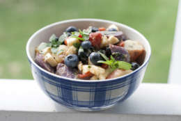 This May 5, 2014 photo shows red, white and blue potato salad in Concord, N.H. Red and purple potatoes, roasted red peppers, cubes of white goat cheese, and several cups of blueberries provide patriotic colors that reflect the spirit of the Fourth of July holiday.  (AP Photo/Matthew Mead)