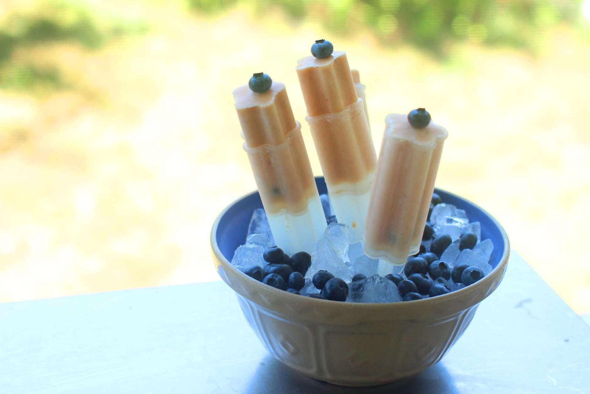 This Aug. 3, 2015 photo shows peach blueberry frozen pops in Concord, NH.This easy recipe for peach-blueberry frozen pops is a great way to use some of your frozen fruit stash any time of year. (AP Photo/Matthew Mead)