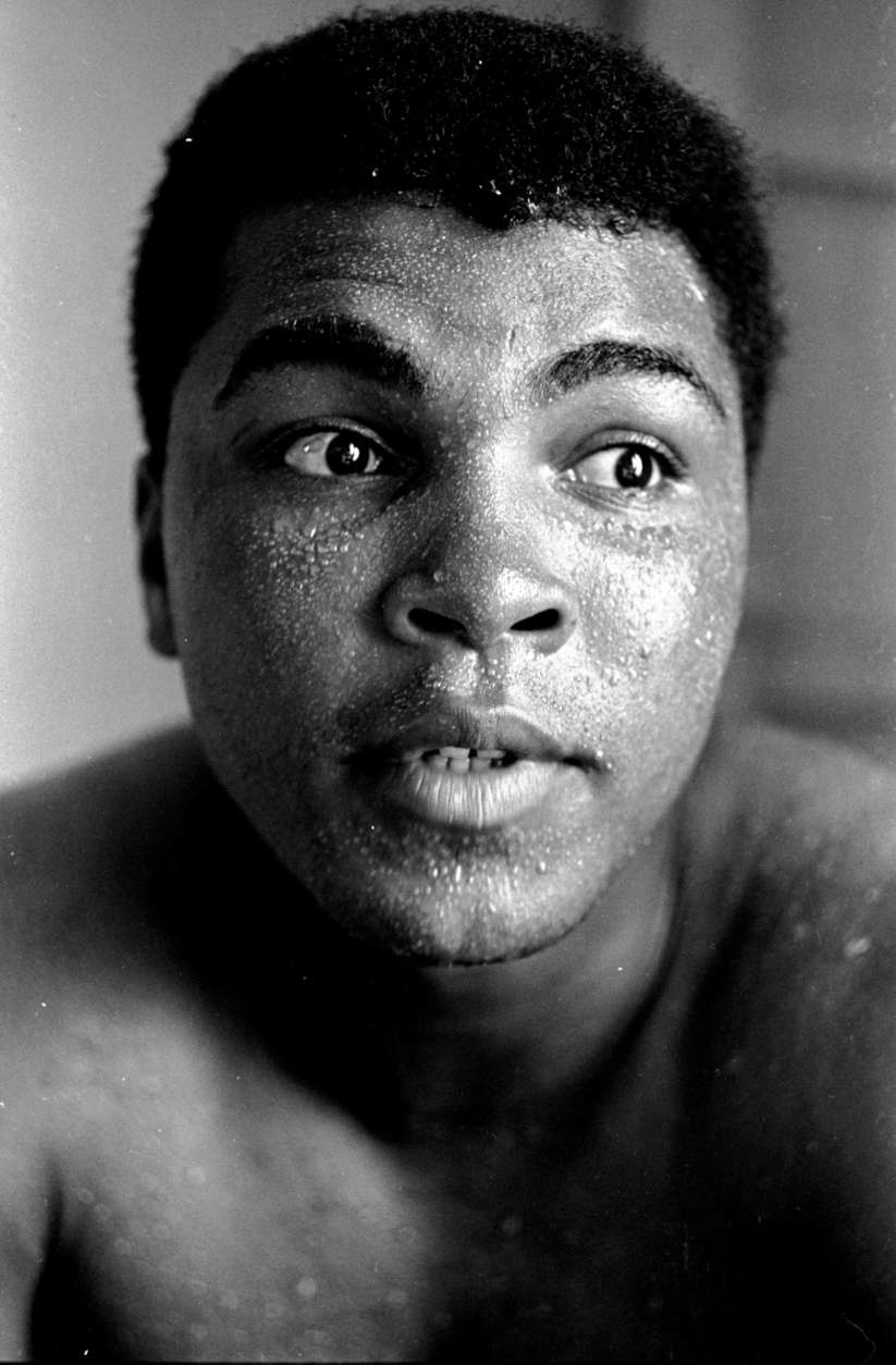 Perspiration beads the face of world heavyweight boxing champion Muhammad Ali shown in training for his May 25, 1965 fight with Sonny Liston at Lewiston, Maine.  (AP Photo)