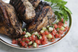 This April 14, 2014 photo shows grilled jerk chicken breast with watermelon salsa in Concord, N.H. Jerk refers both to a unique blend of seasonings and to a method of slow cooking. (AP Photo/Matthew Mead)