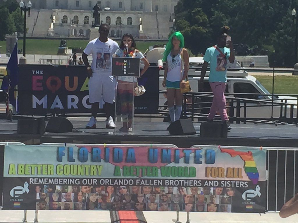 Survivors from the Pulse night club shooting in Orlando speak during the Equality Rally in D.C. on Sunday, June 11, 2017.  (WTOP/John Domen)