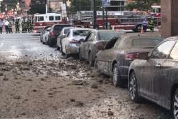 Cars are covered in dirt after an explosion on South Eutaw Street, in Baltimore that Baltimore Fire said was due to a broken pipe. (Courtesy Baltimore Fire)