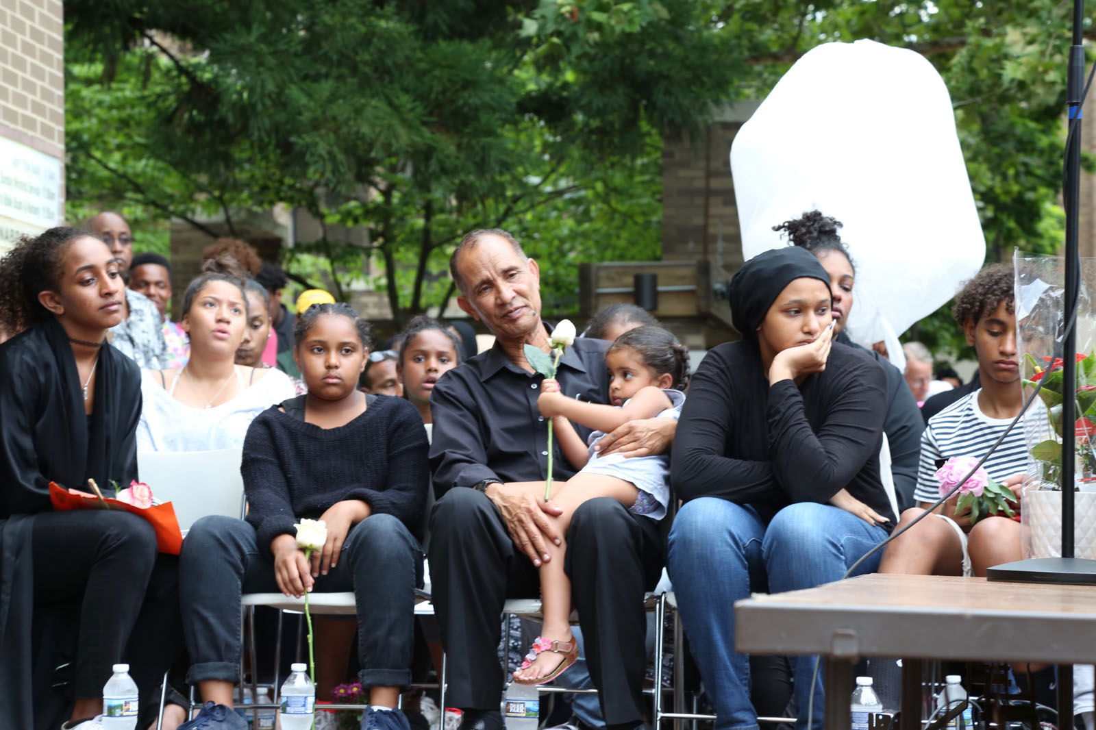 Nabra Hassanen's family looks on at a vigil in honor of Nabra on Wednesday, June 21, 2017, in Reston, Va. (WTOP/Omama Altaleb)