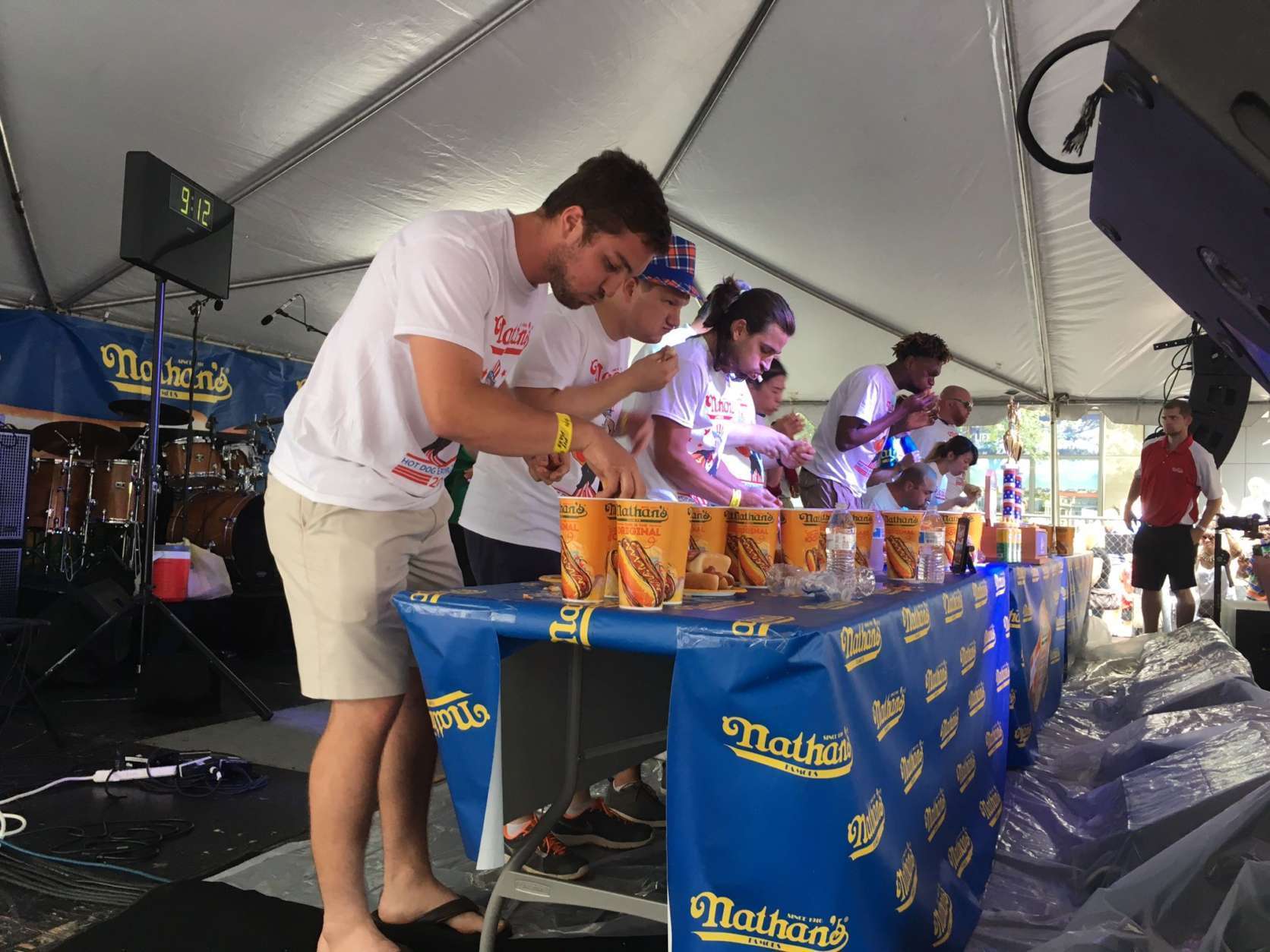 Contestants compete in the local qualifier for the Nathan's Famous Hot Dog Eating contest, which took place this past Saturday at the Giant National Capital BBQ Battle downtown. (WTOP/Noah Frank)