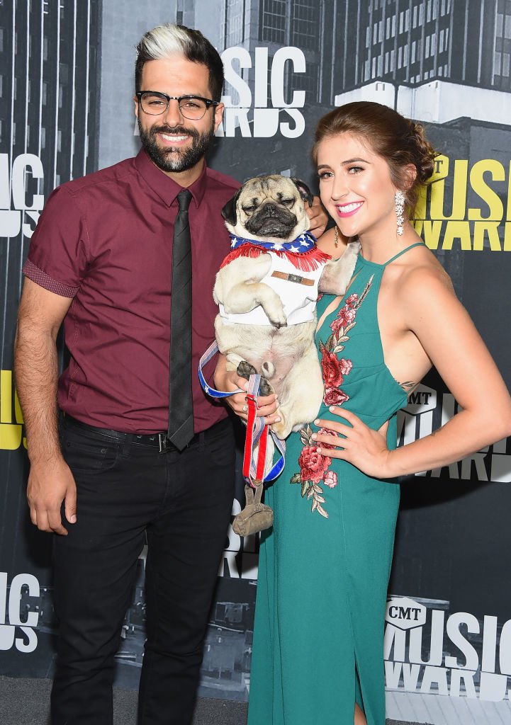  Doug the Pug (C), Leslie Mosier (R) and guest attend the 2017 CMT Music Awards at the Music City Center on June 7, 2017 in Nashville, Tennessee. (Photo by Michael Loccisano/Getty Images For CMT)