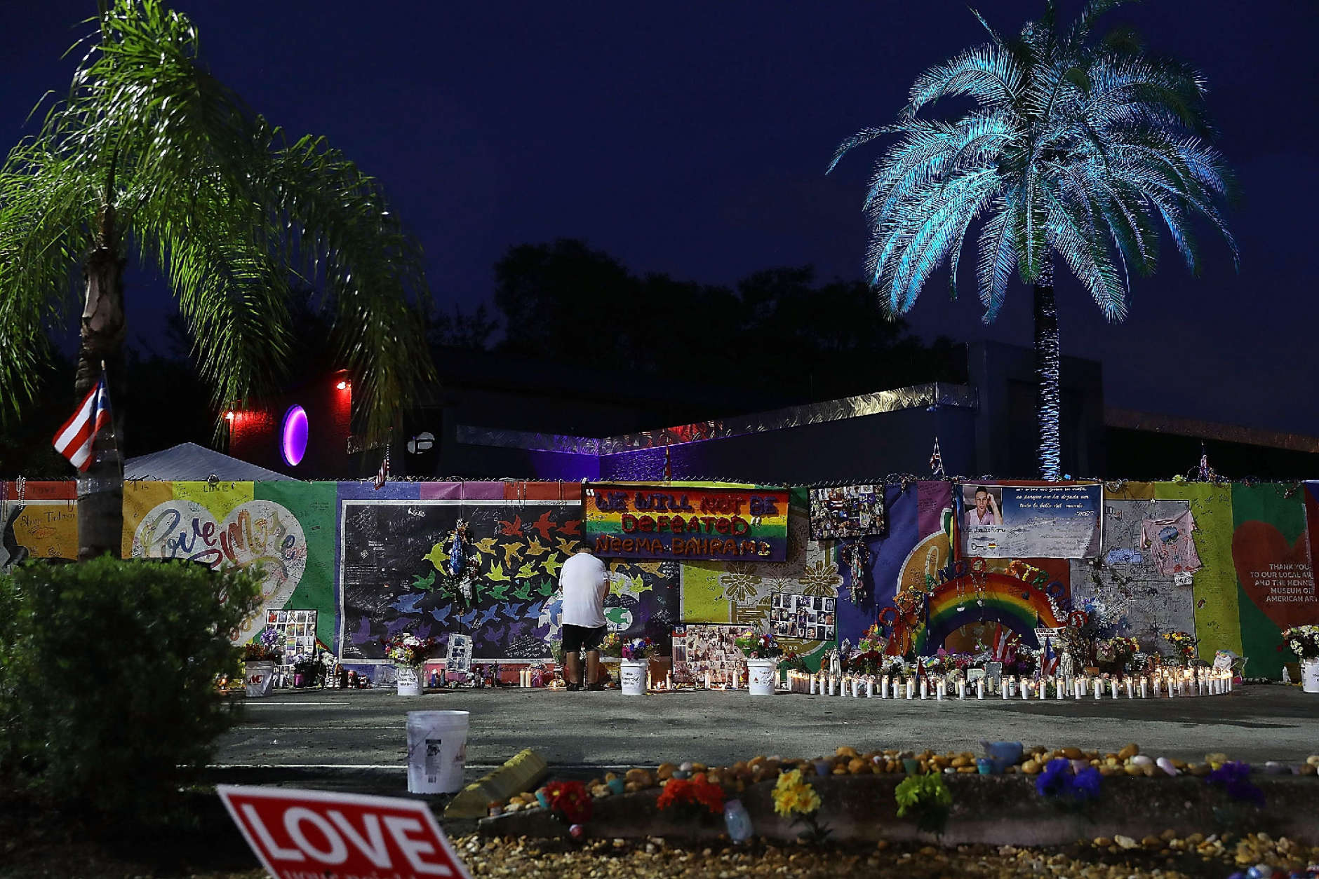 ORLANDO, FL - JUNE 12:  John Hough visits the memorial setup outside the Pulse gay nightclub as he remembers the victims of a mass shooting at the club one year ago on June 12, 2017 in Orlando, Florida. Omar Mateen killed 49 people at the club a little after 2 a.m. on June 12, 2016.  (Photo by Joe Raedle/Getty Images)