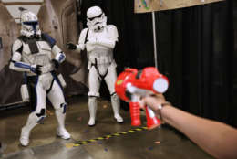 Members of the 501st Legion, a Star Wars cosplay group, help raise money for charity by letting people shoot Nerf darts at them during the first day of Awesome Con at the Walter E. Washington Convention Center June 16, 2017 in Washington, DC. Thousands of fans of popular culture, fantasy and science fiction will gather for the three-day convention that includes comic books, collectibles, toys, games, original art, cosplay and Marvel Comics legend Stan Lee.  (Photo by Chip Somodevilla/Getty Images)