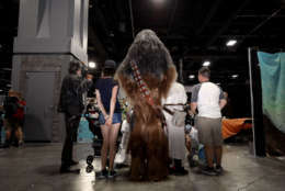 Members of the 501st Legion, a Star Wars cosplay group, pose for photographs with fans during the first day of Awesome Con at the Walter E. Washington Convention Center June 16, 2017 in Washington, DC. Thousands of fans of popular culture, fantasy and science fiction will gather for the three-day convention that includes comic books, collectibles, toys, games, original art, cosplay and Marvel Comics legend Stan Lee.  (Photo by Chip Somodevilla/Getty Images)