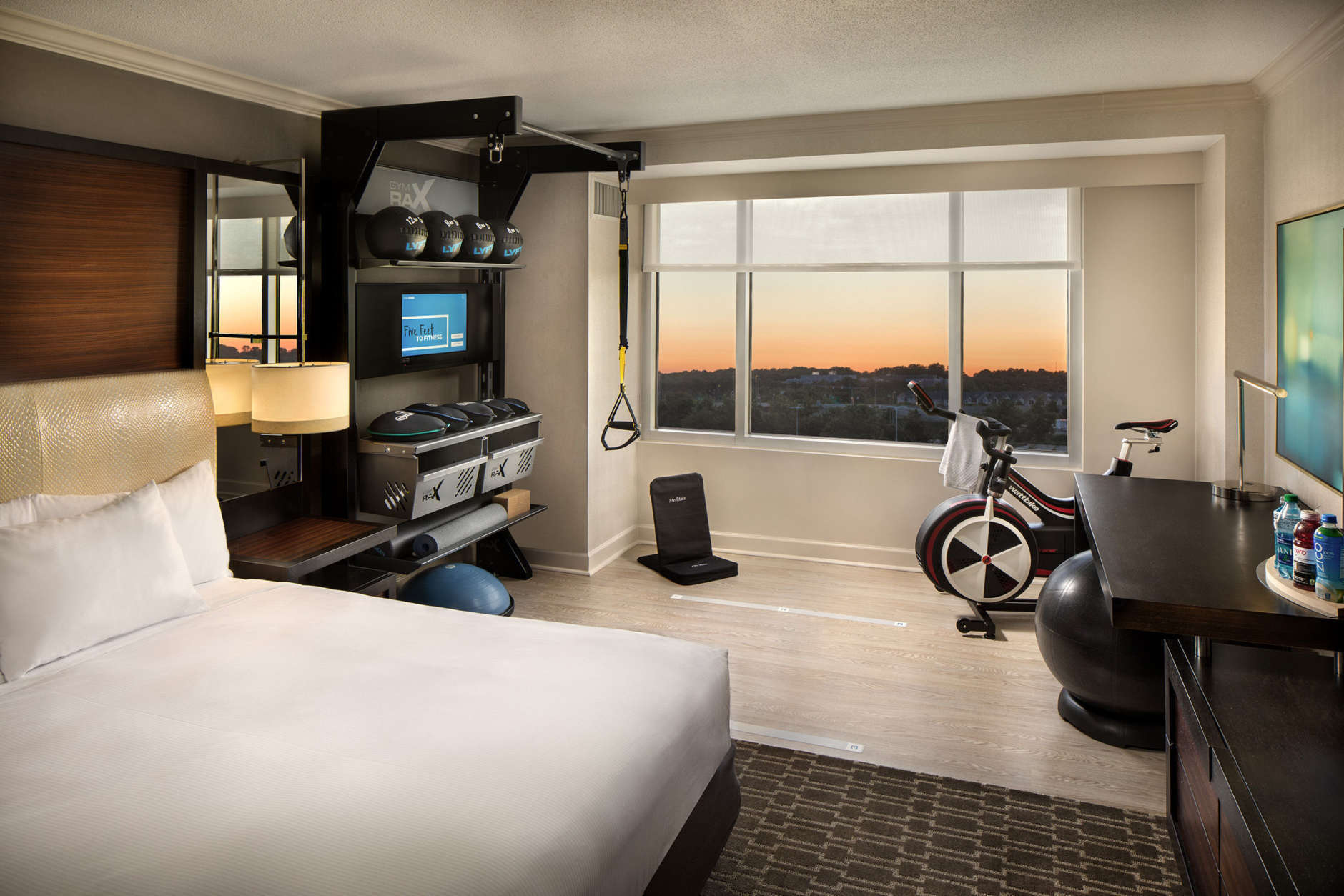 At Hilton McLean Tysons Corner, there's no need to rush down to the gym to squeeze in your morning workout. A handful of rooms in the Northern Virginia hotel come equipped with their own personal gyms — complete with a stationary bike, a meditation chair, a yoga mat and a dynamic GymRax training station for core, strength and high-intensity interval training workouts. (Courtesy Hilton Hotels & Resorts)