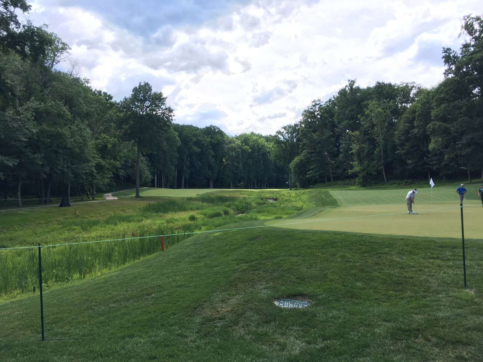 There's a footbridge over a creek that offers a nice, unobstructed view back to the 11th green, which is also the last chance you'll have to turn back to the clubhouse on the back nine before hitting some pretty steep hills. (WTOP/Noah Frank)