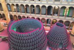 The National Building Museum is abuzz this week — literally. Architects and construction crews are “busy as bees” putting the finishing touches on this year’s Summer Block Party exhibit, Hive, which opens July 4. (WTOP/Rachel Nania)