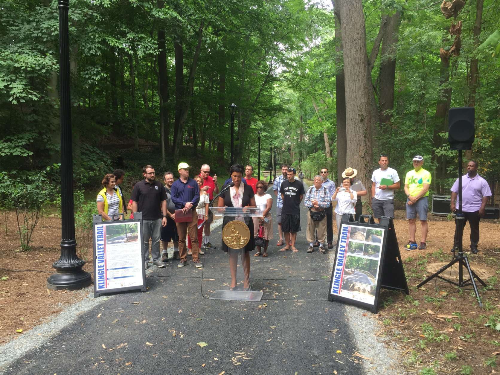 D.C. Mayor Muriel Bowser addresses a crowd during a ribbon-cutting ceremony for Klingle Valley Trail on Saturday, June 24, 2017. (WTOP/Mike Murillo)