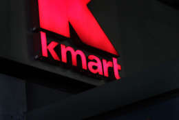 FILE - This Nov. 9, 2011 file photo, shows signs at a Kmart store, in New York. Kmart, a division of Sears Holdings Corp., said Friday, Sept. 7, 2012, that it's waiving the fees that shoppers pay to open its interest-free pay-over-time program at its discount stores and online through  Nov. 17. (AP Photo/Mark Lennihan, File)