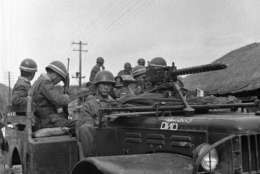 South Korean army troops man American built trucks on June 25, 1950, as they defend their country land against Russian invasion. North Korean Communist troops invaded the American sponsored South Korean republic causing an international situation. (AP Phot/T. Lambert )
